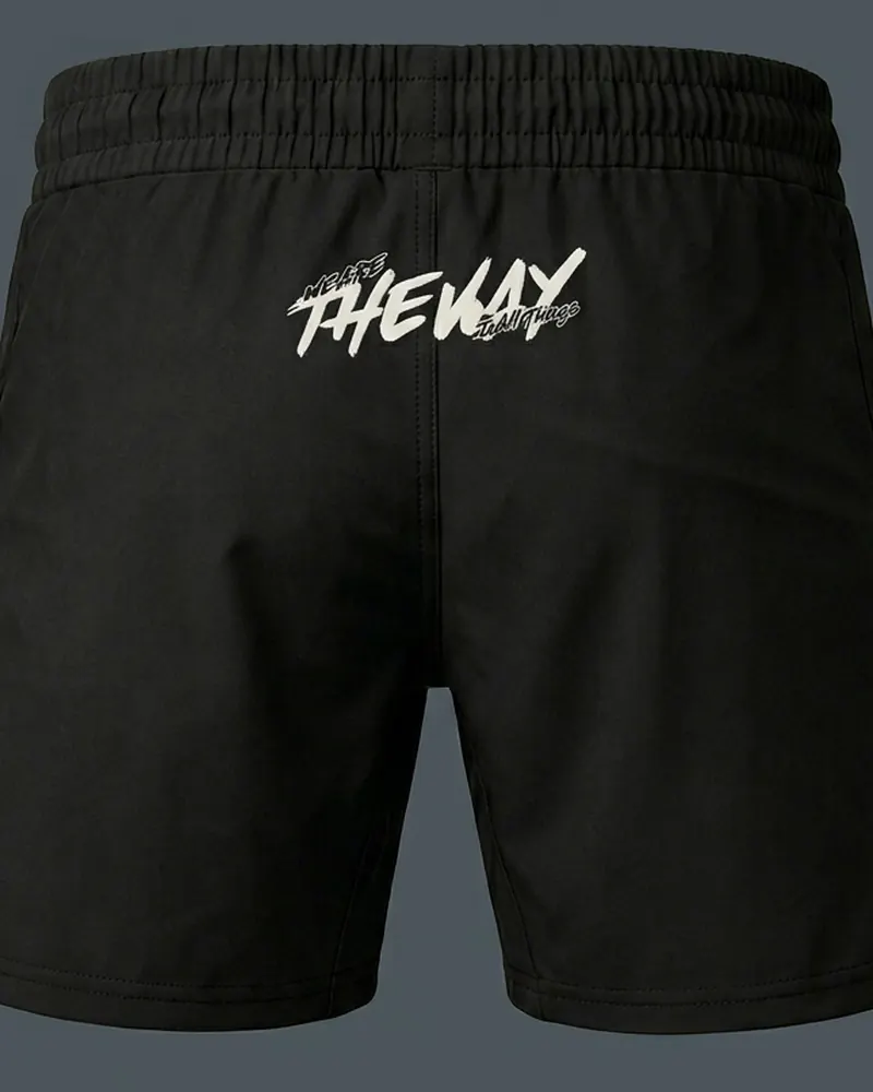Short de combate negro con cintura elástica y aberturas laterales, espalda